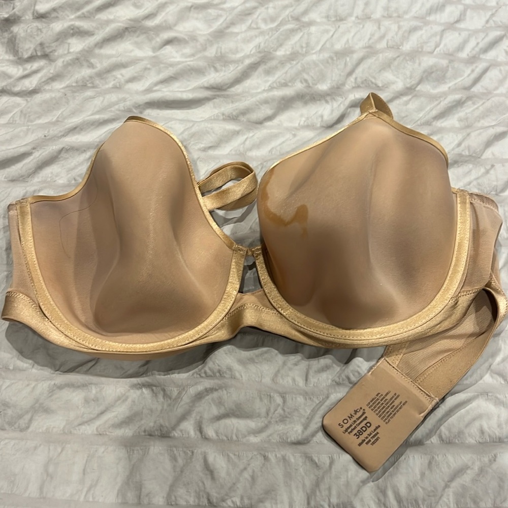 38 DD beige bra brand Soma Bra with a stain otherwise like new.